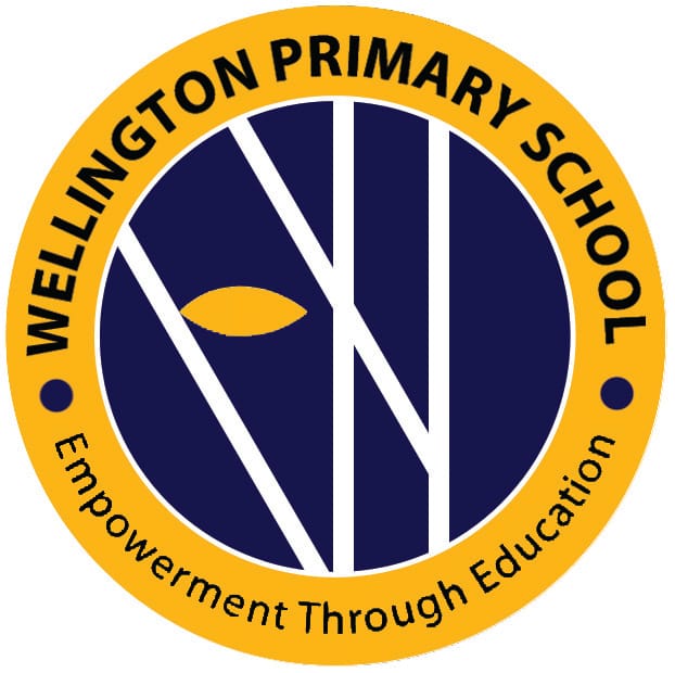 Round gold badge for Wellington Primary School with navy blue center and motto Empowerment Through Education.